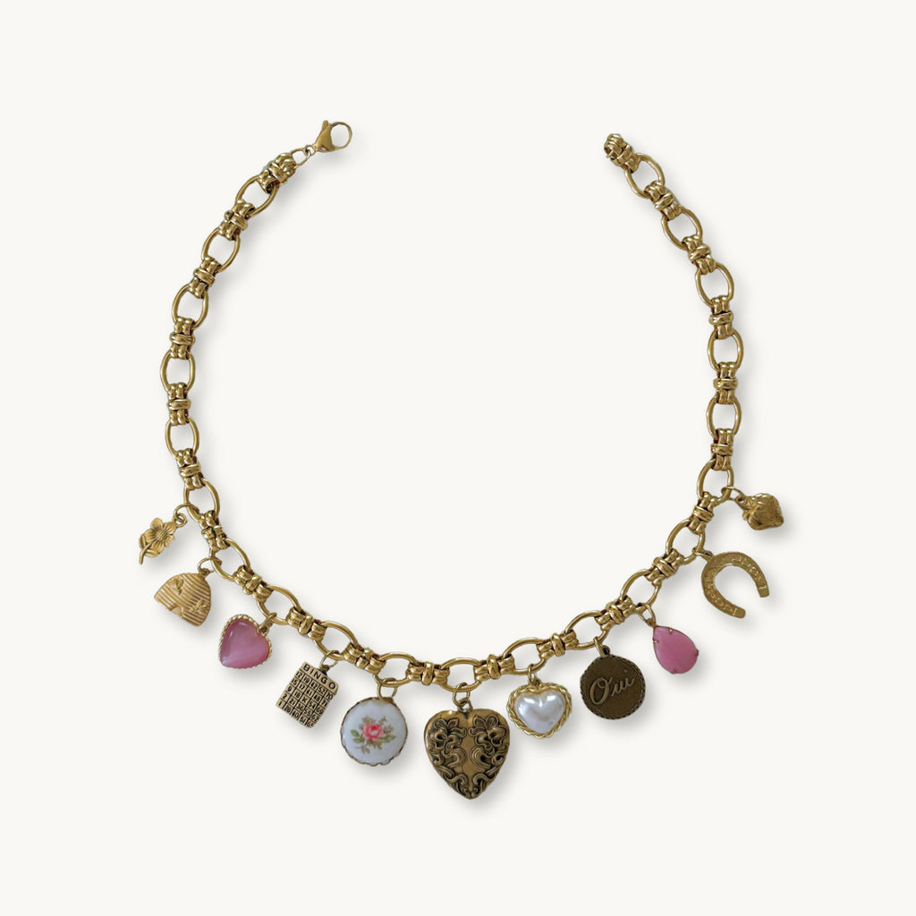 Flat-lay of the Scarlett Necklace against a neutral background, showcasing its timeless beauty.