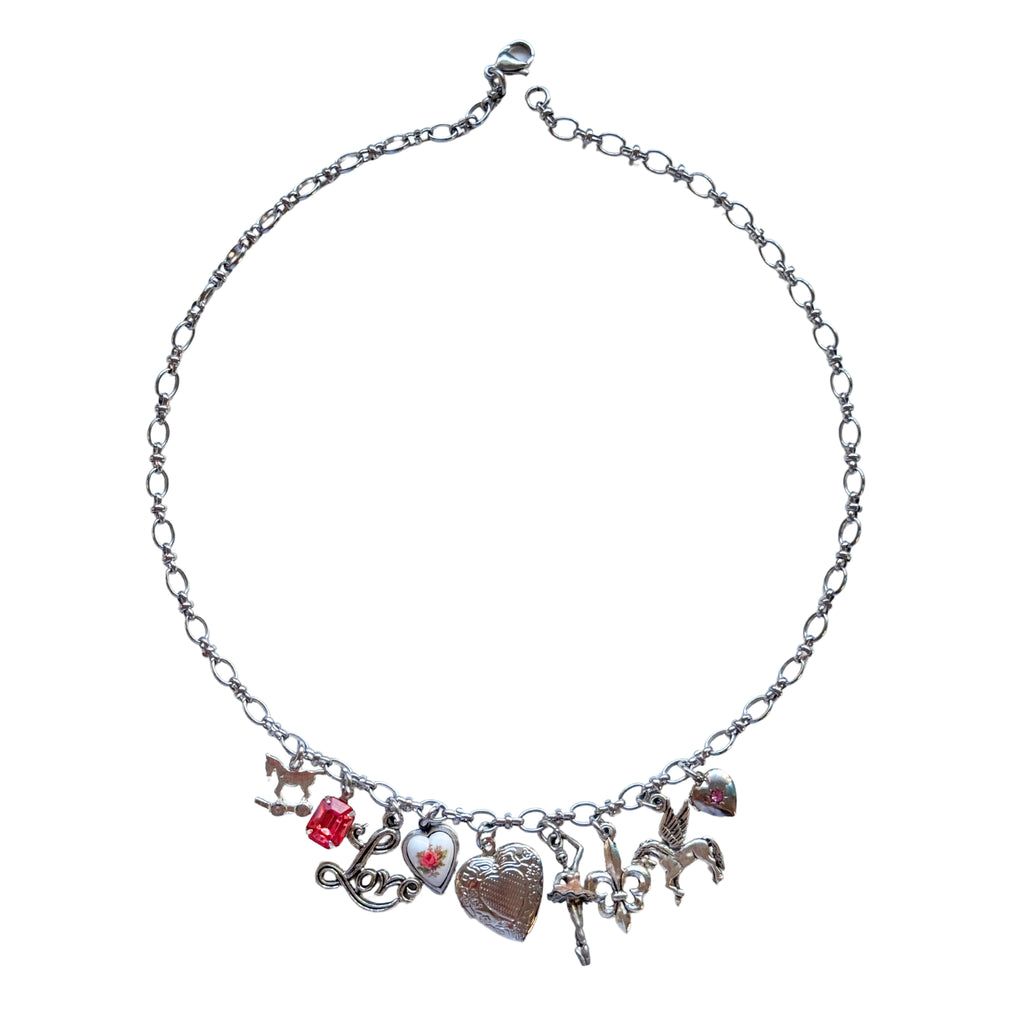 Tamara Necklace flatlay showing detailed charms