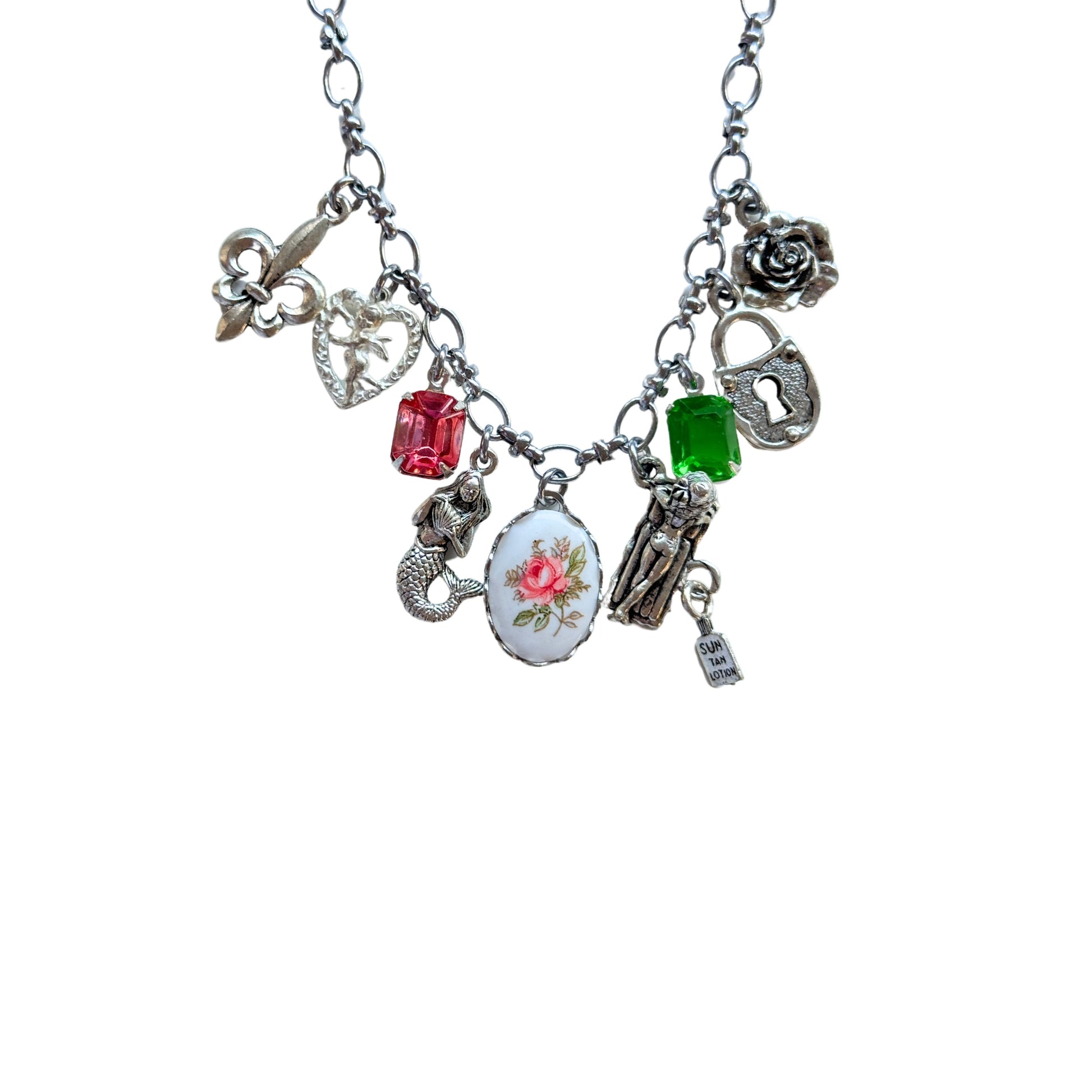 Close-up of mermaid, fleur de lis, and ceramic rose details