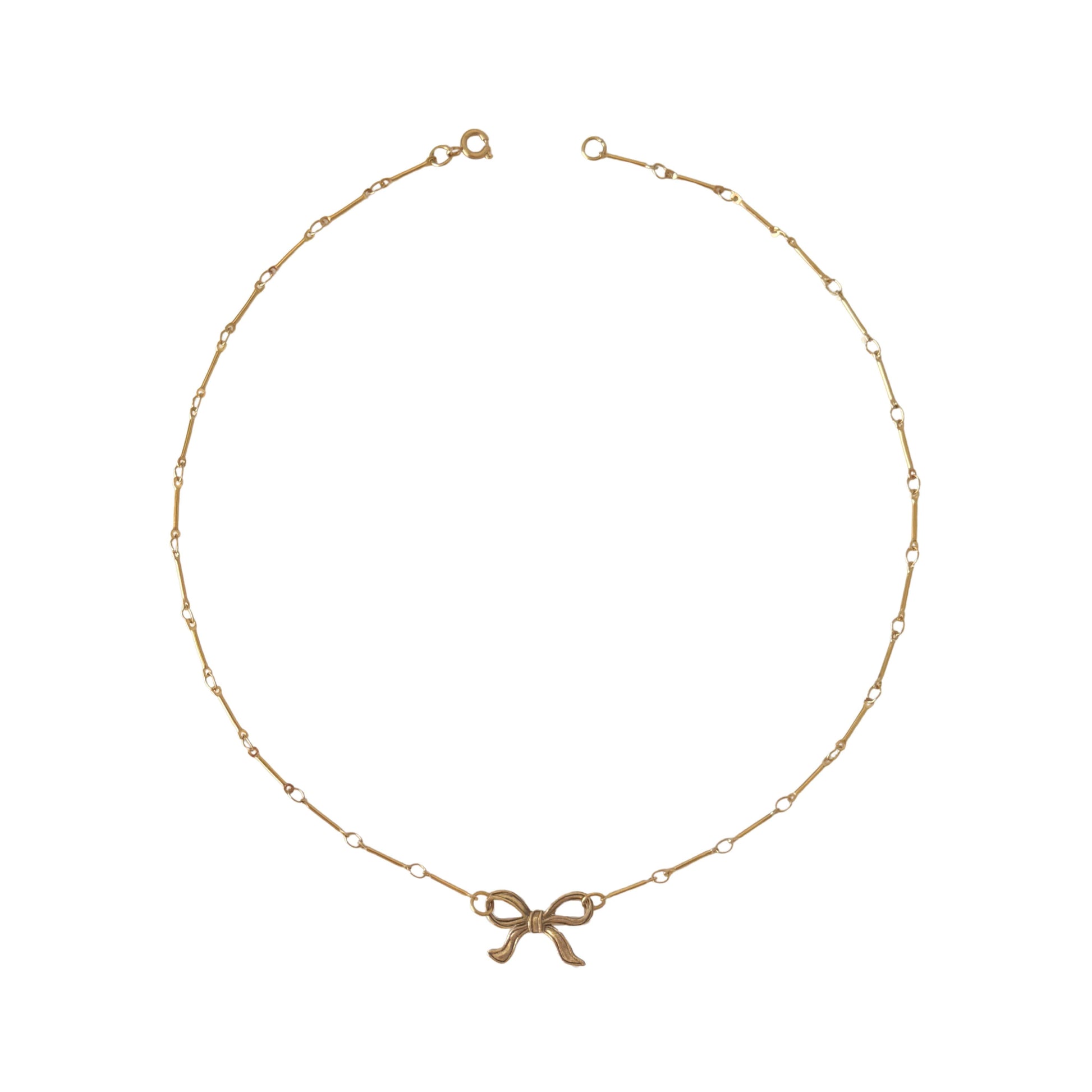 PVD gold-plated Tullah Necklace with bow detail, perfect for adding a feminine touch to casual or dressy outfits