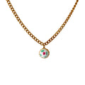 Close-up of hand-painted milky ceramic pendant on Cuban chain
