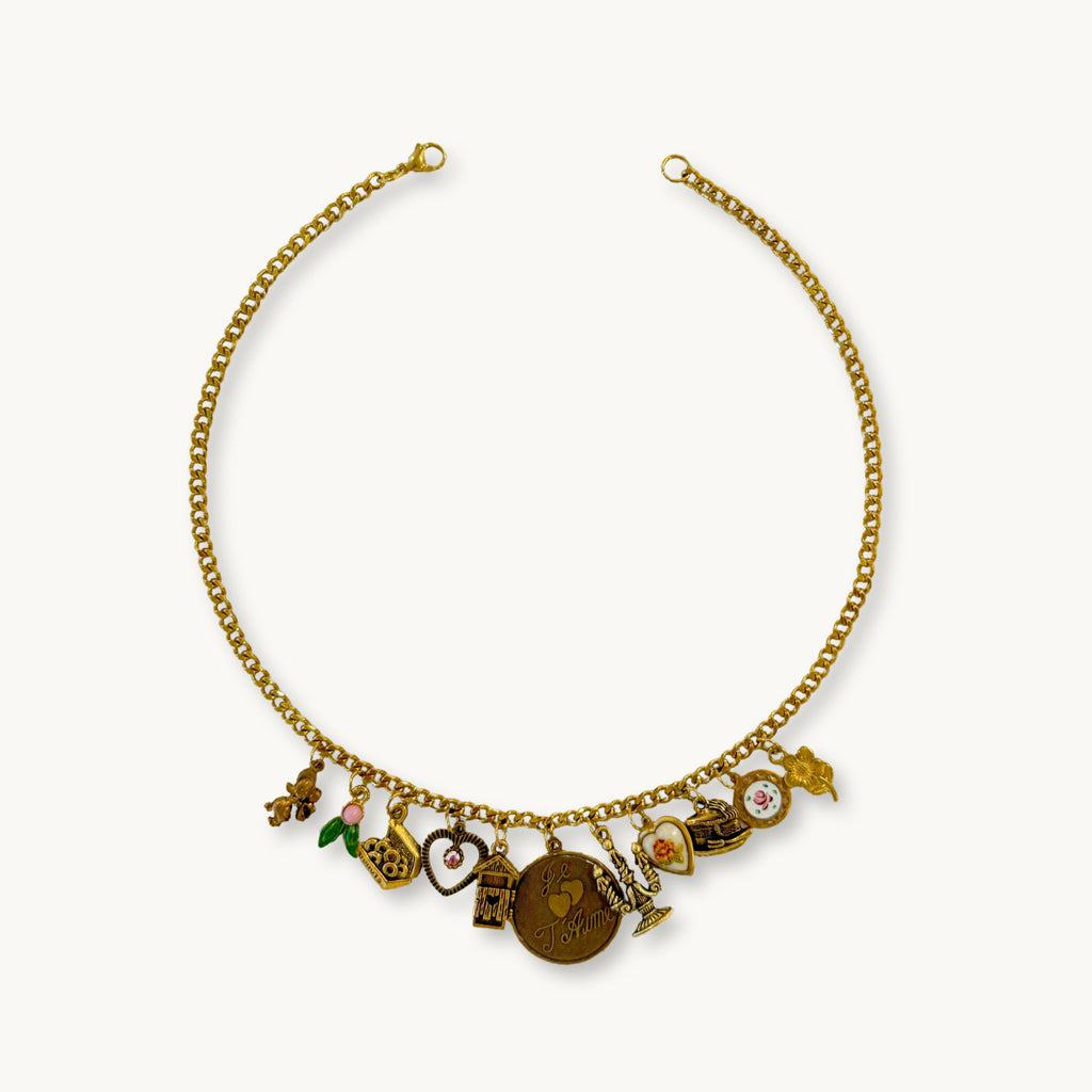 Flat-lay of the Willow Necklace showing its full layout and nostalgic charm mix.