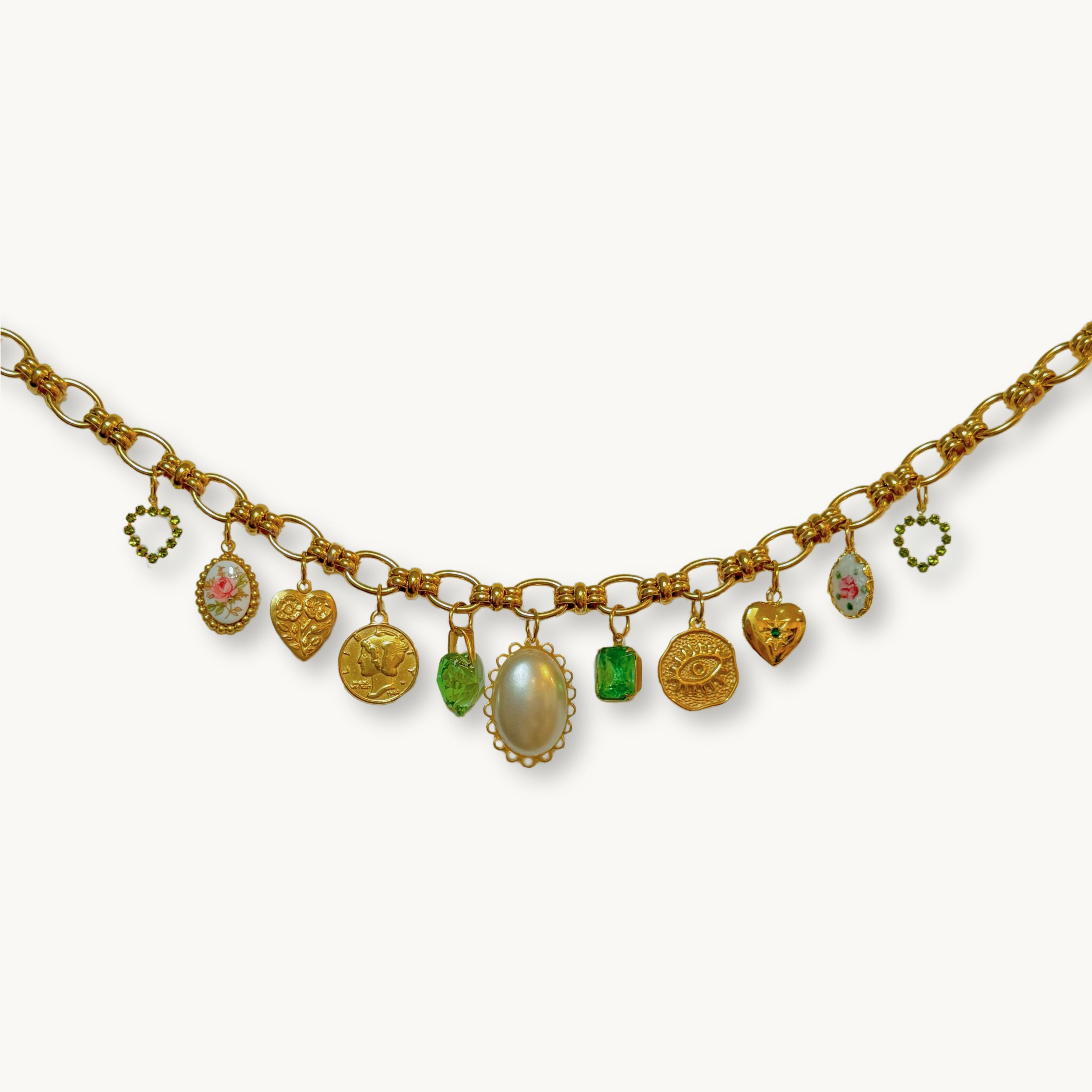 Close-up of the Zoe Necklace highlighting vintage guilloche and glass stone details